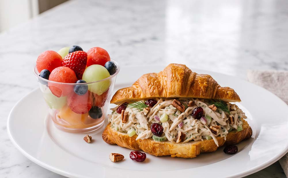 Creamy chicken salad with chopped pecans, cranberries, and celery